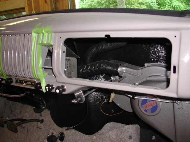 12_newdash The dash is being prepped for painting of the radio grill stripes.  The air-flow heater went in after muttering a few choice words.