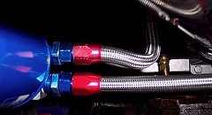  In this view from below the filter, the spin-on filter is at the left, the return line is at the top, and the supply line is at the bottom.  The hose is 1/2