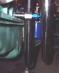  The forward port for the oil supply line is blocked by one of the dual exhausts.  A 1/2
