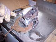 There is wasted powder on the work surface because our borrowed oxy-acetylene torch had an oxygen valve that could not be adjusted below 40 psi.  I think that Mike said that 5-10 psi on the oxygen delivers the appropriate flow of powder.
